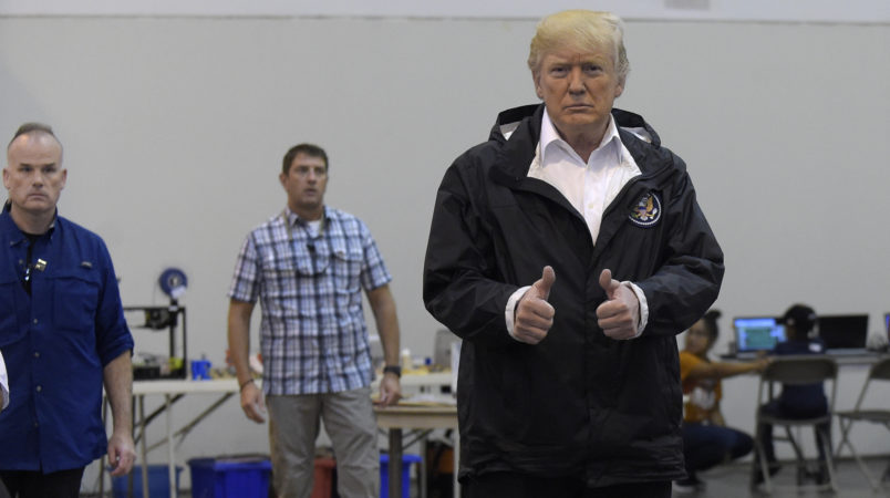 President Donald Trump gives a thumbs up after meeting people impacted by Hurricane Harvey during a visit to the NRG Center in Houston, Saturday, Sept. 2, 2017. (AP Photo/Susan Walsh)
