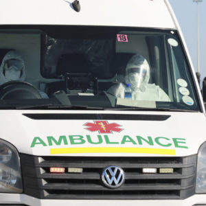 In this photo taken Tuesday, May 19, 2020, paramedics in protective gear drive in an ambulance in Khayelitsha in Cape Town South Africa,  With dramatically increased community transmission, Cape Town has become the center of the COVID-19 outbreak in South Africa and the entire continent. (AP Photo/Nardus Engelbrecht)