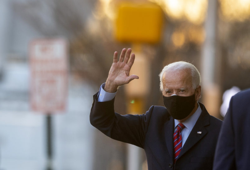 WILMINGTON, DE - NOVEMBER 23: President-elect Joe Biden waves as he departs the Queen Theatre after meeting virtually with the United States Conference of Mayors on November 23, 2020 in Wilmington, Delaware. As President-elect Biden waits to be approved for official national security briefings, the names of top members of his national security team are being announced to the public. (Photo by Mark Makela/Getty Images)