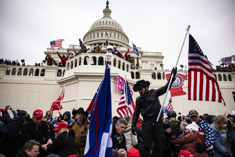 WASHINGTON, DC - JANUARY 06: Pro-Trump supporters storm the US Capitol following a rally with President Donald Trump on January 6, 2021 in Washington, DC. Trump supporters gathered in the nation's capital today to protest the ratification of President-elect Joe Biden's Electoral College victory over President Trump in the 2020 election. (Photo by Samuel Corum/Getty Images)