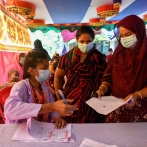 DHAKA, BANGLADESH - 2021/08/18: A health worker seen registering sex workers against the Covid-19 coronavirus at special vaccination drive held in Daulatdia outskirt of Dhaka. (Photo by Piyas Biswas/SOPA Images/LightRocket via Getty Images)