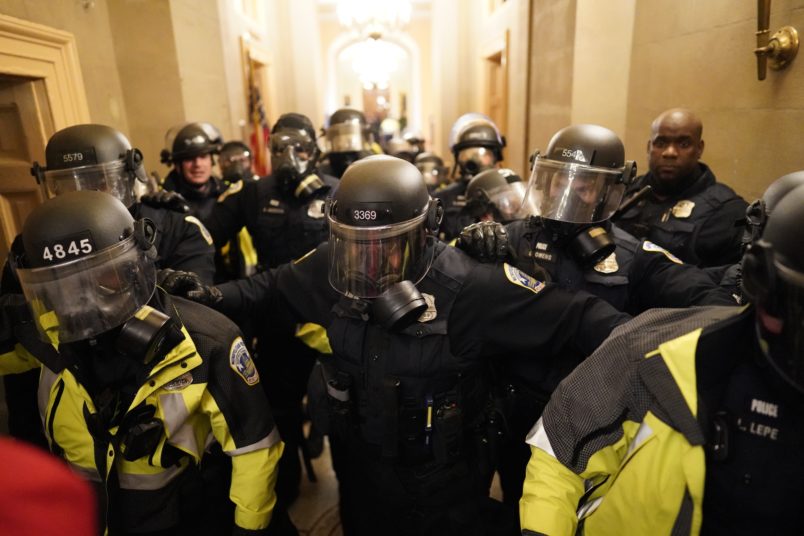 WASHINGTON, DC - JANUARY 06:  Riot police clear the hallway inside the Capitol on Wednesday, Jan. 6, 2021 in Washington, DC. (Kent Nishimura / Los Angeles Times)