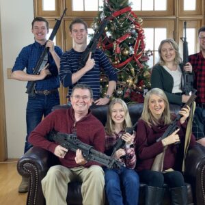 Massie family holding guns