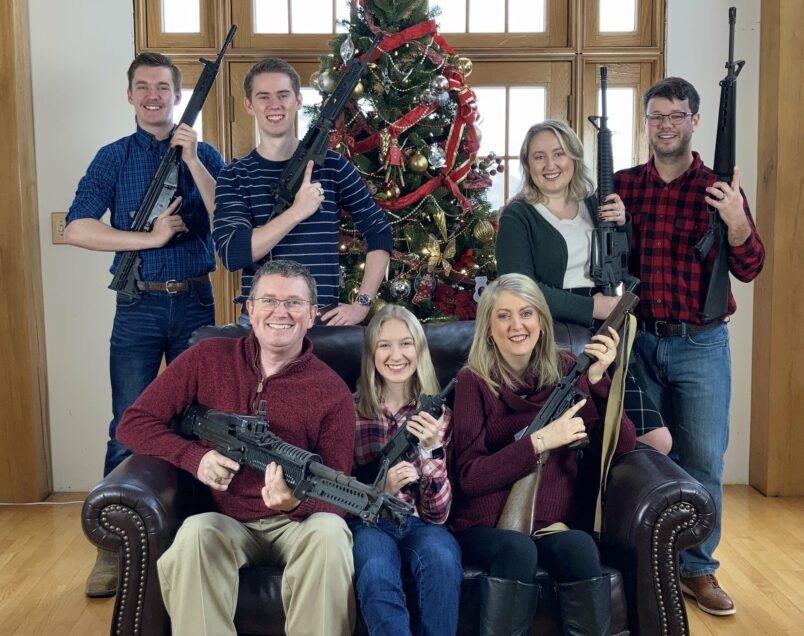 Massie family holding guns